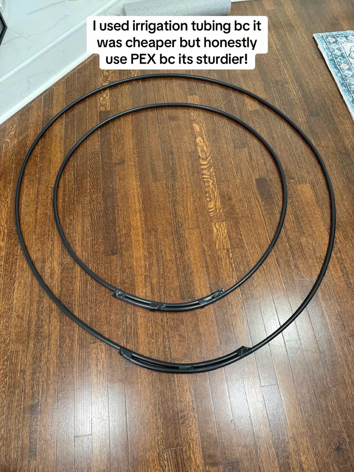 Two large tubing rings on the floor forming the wreath base