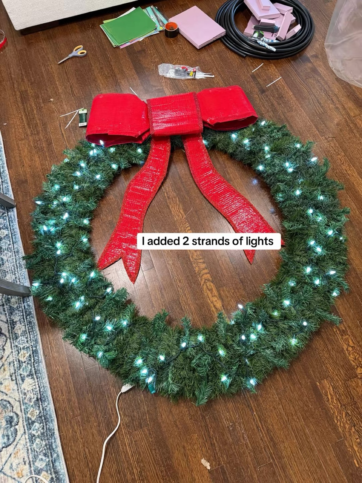 Finished wreath with bow and two strands of lights